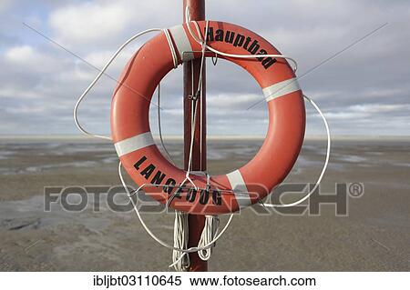 "Lifebuoy on the main beach, Langeoog, Ostfriesische Inseln, Lower Saxony, Germany, Europe" View Large Photo Image Stock Photography - "Lifebuoy on the main beach, Langeoog, Ostfriesische Inseln, Lower Saxony, Germany, Europe". Fotosearch