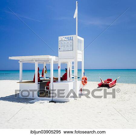 "Lifeguard tower and rescue boat on the beach of Simius, Villasimius, Sarrabus, Cagliari Province, Sardinia, Italy, Europe" View Large Photo Image Stock Photography - "Lifeguard tower and rescue boat on the beach of Simius, Villasimius, Sarrabus, Cagliari Province, Sardinia, Italy, Europe". Fotosearch