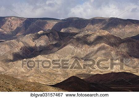 Stock Photo - "Light and shadows in a broad landscape with hills, Richtersveld Nationalpark, Northern Cape, South Africa, Africa". Fotosearch