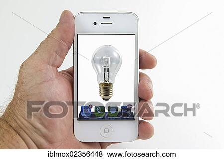 "Light bulb on the screen of a smartphone, symbolic image for remote-controlled lights, mobile phone as a remote control" View Large Photo Image Stock Photo - "Light bulb on the screen of a smartphone, symbolic image for remote-controlled lights, mobile phone as a remote control". Fotosearch