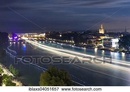 Stock Photo - "Light tracers of ships on the Rhine River during the Seenachtfest Festival, Constance Minster at the rear, Konstanz, Baden-Wurttemberg, Germany, Europe". Fotosearch