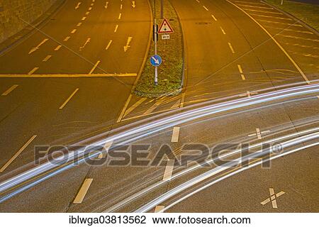 Stock Image - "Light trails of left turning vehicles, Cologne, North Rhine-Westphalia, Germany, Europe". Fotosearch