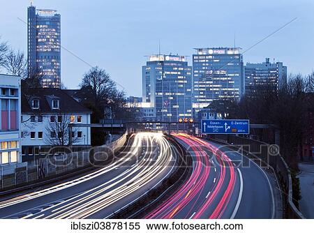 Stock Photography - "Light trails of moving traffic at dusk, Ruhrschnellweg, A 40 motorway, Essen, Ruhr Area, North Rhine-Westphalia, Germany, Europe". Fotosearch