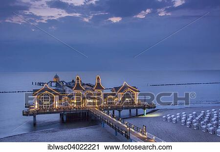 Stock Image - "Lighted pier Sellin, Rugen island, Mecklenburg-Western Pomerania, Germany, Europe". Fotosearch