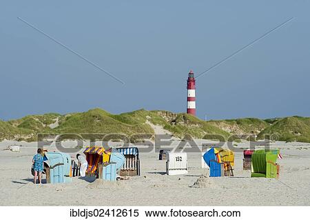 Lighthouse and beach chairs, Amrum, North Frisia, Schleswig-Holstein, Germany, Europe View Large Photo Image Stock Photography - Lighthouse and beach chairs, Amrum, North Frisia, Schleswig-Holstein, Germany, Europe. Fotosearch