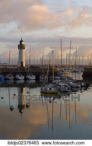 "Lighthouse and boats reflected in the eastern harbor in the early morning, Port-Haliguen in Quiberon, southern Brittany, Bretagne, France, Europe" View Large Photo Image Stock Image - "Lighthouse and boats reflected in the eastern harbor in the early morning, Port-Haliguen in Quiberon, southern Brittany, Bretagne, France, Europe". Fotosearch