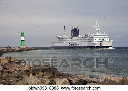 Stock Photo - "Lighthouse and the Scandlines ferry """"Kronprins Frederic"""", Warnemunde, Rostock, Mecklenburg-Western Pomerania, Germany, Europe". Fotosearch