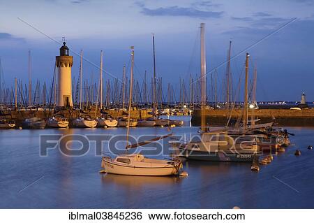 "Lighthouse at the old fishing harbour of Port Haliguen, Quiberon, Cote de Morbihan, Brittany, France, Europe" View Large Photo Image Stock Photograph - "Lighthouse at the old fishing harbour of Port Haliguen, Quiberon, Cote de Morbihan, Brittany, France, Europe". Fotosearch