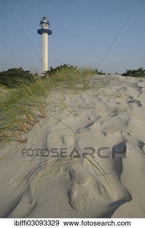 "Lighthouse behind a sand dune, Dueodde, Bornholm, Capital Region of Denmark, Denmark, Europe" View Large Photo Image Stock Photo - "Lighthouse behind a sand dune, Dueodde, Bornholm, Capital Region of Denmark, Denmark, Europe". Fotosearch