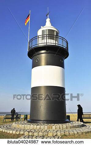 Stock Photo - "Lighthouse Kleiner Preusse at the fishing port, Wremen, Lower Saxony, Germany, Europe". Fotosearch