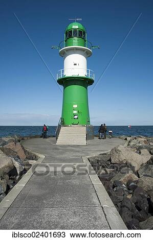 Stock Image - "Lighthouse on the Warnow River estuary, Warnemuende, Mecklenburg-Western Pomerania, Germany, Europe". Fotosearch