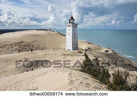 "Lighthouse with the Rubjerg Knude migrating dune on the North Sea coast, Region Nordjylland, Jutland, Denmark, Europe" View Large Photo Image Picture - "Lighthouse with the Rubjerg Knude migrating dune on the North Sea coast, Region Nordjylland, Jutland, Denmark, Europe". Fotosearch