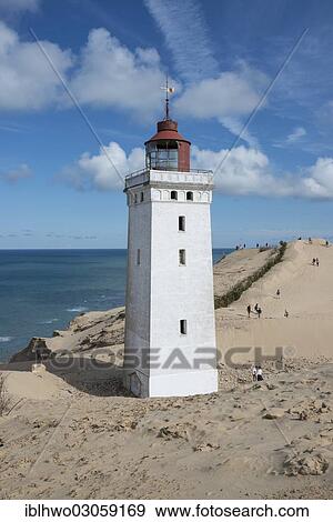 "Lighthouse with the Rubjerg Knude migrating dune on the North Sea coast, Region Nordjylland, Jutland, Denmark, Europe" View Large Photo Image Stock Photo - "Lighthouse with the Rubjerg Knude migrating dune on the North Sea coast, Region Nordjylland, Jutland, Denmark, Europe". Fotosearch