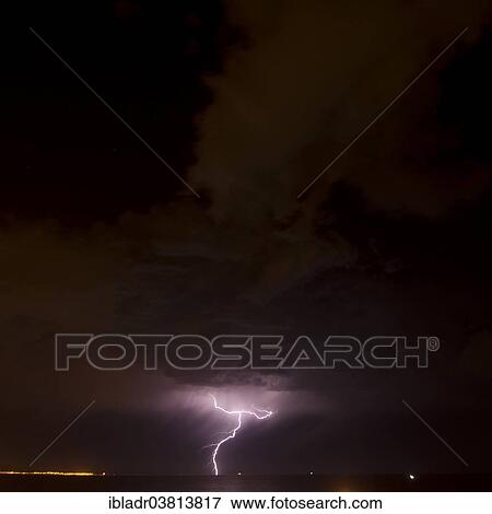 Stock Photo - Lightning over the sea. Fotosearch