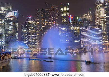 "Lightshow in front of downtown central financial district at night, Singapore, Asia" View Large Photo Image Stock Photo - "Lightshow in front of downtown central financial district at night, Singapore, Asia". Fotosearch