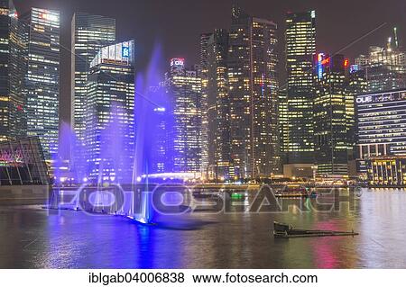 "Lightshow in front of downtown central financial district at night, Singapore, Asia" View Large Photo Image Stock Photo - "Lightshow in front of downtown central financial district at night, Singapore, Asia". Fotosearch