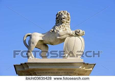 Stock Photo - "Lion sculpture, Schloss Nordkirchen palace, a baroque moated castle accommodating Fachhochschule fur Finanzen NRW university, Nordkirchen, Munsterland, Nordrhein-Westfalen, Germany, Europe". Fotosearch