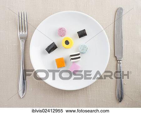 Liquorice candy served on a plate View Large Photo Image Stock Photography - Liquorice candy served on a plate. Fotosearch