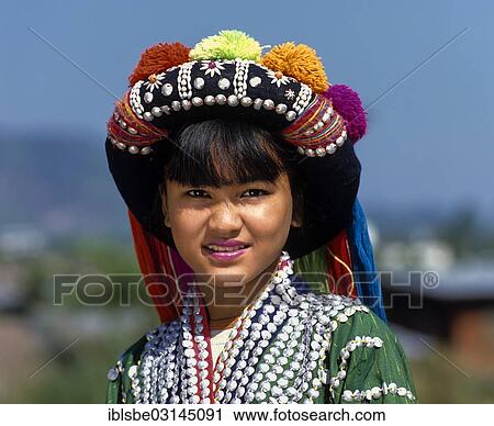 "Lisu girl wearing a colourful headdress and the traditional costume of the mountain people, portrait, Mae Sai, Chiang Rai Province, Northern Thailand, Thailand, Asia" View Large Photo Image Stock Image - "Lisu girl wearing a colourful headdress and the traditional costume of the mountain people, portrait, Mae Sai, Chiang Rai Province, Northern Thailand, Thailand, Asia". Fotosearch