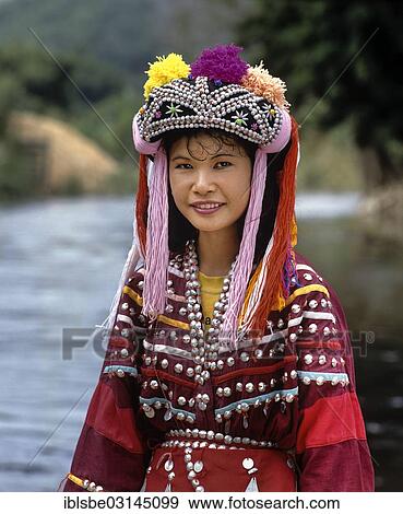 "Lisu girl wearing a colourful headdress and the traditional costume of the mountain people, Mae Sai, Chiang Rai Province, Northern Thailand, Thailand, Asia" View Large Photo Image Stock Photo - "Lisu girl wearing a colourful headdress and the traditional costume of the mountain people, Mae Sai, Chiang Rai Province, Northern Thailand, Thailand, Asia". Fotosearch