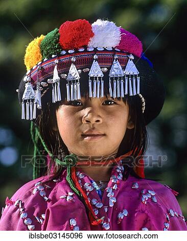"Lisu girl wearing a colourful headdress and the traditional costume of the mountain people, portrait, Mae Sai, Chiang Rai Province, Northern Thailand, Thailand, Asia" View Large Photo Image Stock Photograph - "Lisu girl wearing a colourful headdress and the traditional costume of the mountain people, portrait, Mae Sai, Chiang Rai Province, Northern Thailand, Thailand, Asia". Fotosearch