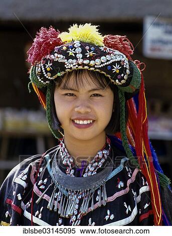 "Lisu girl wearing a colourful headdress and the traditional costume of the mountain people, portrait, Mae Sai, Chiang Rai Province, Northern Thailand, Thailand, Asia" View Large Photo Image Stock Photography - "Lisu girl wearing a colourful headdress and the traditional costume of the mountain people, portrait, Mae Sai, Chiang Rai Province, Northern Thailand, Thailand, Asia". Fotosearch
