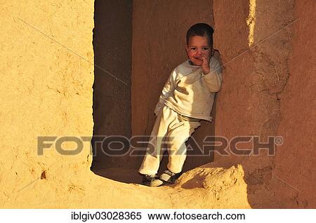Stock Photography - "Little boy at the Oulad Othmane Kasbah, Draatal, Oulad Othmane, Souss-Massa-Draa region, Morocco, Africa". Fotosearch