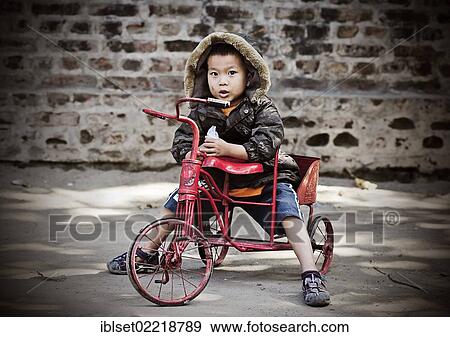 "Little boy riding a tricycle in Yangon, Burma also known as Myanmar, Southeast Asia, Asia" View Large Photo Image Stock Photo - "Little boy riding a tricycle in Yangon, Burma also known as Myanmar, Southeast Asia, Asia". Fotosearch