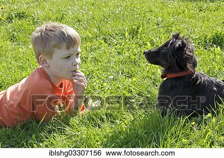 Stock Photograph - "Little boy with his dog, Zarrentin, Mecklenburg-Western Pomerania, Germany, Europe". Fotosearch