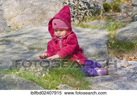 "Little girl playing between rocks in the sand, Ostrov, Czech Republic, Europe" View Large Photo Image Stock Photography - "Little girl playing between rocks in the sand, Ostrov, Czech Republic, Europe". Fotosearch