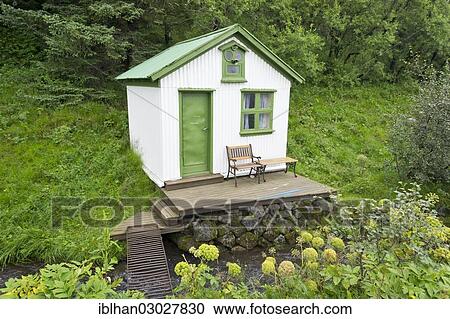 Stock Image - "Little house beside a river, Kirkjubaejarklaustur, Iceland, Europe". Fotosearch