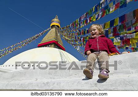 "Little tourist child sitting at the foot of Boudnath Stupa, Kathmandu, Kathmandu District, Bagmati Zone, Nepal, Asia" View Large Photo Image Stock Image - "Little tourist child sitting at the foot of Boudnath Stupa, Kathmandu, Kathmandu District, Bagmati Zone, Nepal, Asia". Fotosearch
