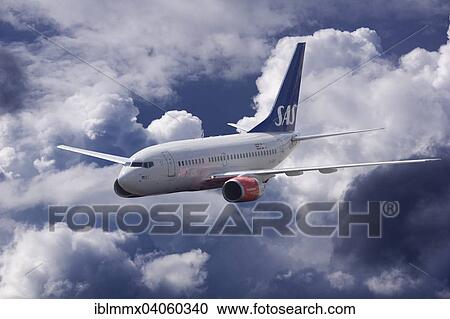 Stock Image - LN-RRR SAS Scandinavian Airlines Boeing 737-683 in flight in stormy weather. Fotosearch
