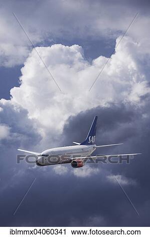 Stock Image - LN-RRR SAS Scandinavian Airlines Boeing 737-683 in flight in stormy weather. Fotosearch