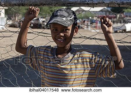 "Local boy with baseball cap, portrait, Keetmanshoop, Namibia, Africa" View Large Photo Image Stock Photo - "Local boy with baseball cap, portrait, Keetmanshoop, Namibia, Africa". Fotosearch