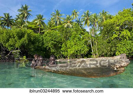 "Local boys in a canoe in the Marovo Lagoon, Marovo Lagoon, Western Province, Solomon Islands, Oceania" View Large Photo Image Stock Photography - "Local boys in a canoe in the Marovo Lagoon, Marovo Lagoon, Western Province, Solomon Islands, Oceania". Fotosearch