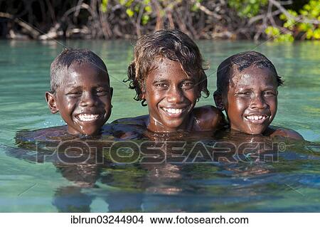 "Local boys in the water of the Marovo Lagoon, Marovo Lagoon, Western Province, Solomon Islands, Oceania" View Large Photo Image Picture - "Local boys in the water of the Marovo Lagoon, Marovo Lagoon, Western Province, Solomon Islands, Oceania". Fotosearch