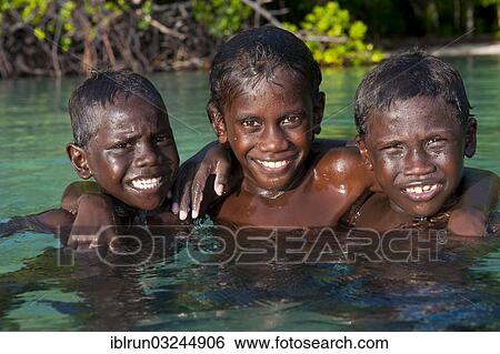 "Local boys in the water of the Marovo Lagoon, Marovo Lagoon, Western Province, Solomon Islands, Oceania" View Large Photo Image Stock Photograph - "Local boys in the water of the Marovo Lagoon, Marovo Lagoon, Western Province, Solomon Islands, Oceania". Fotosearch