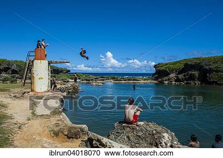"Local boys jumping and swimming in the Salugula Pool, Guam, US Territory, Pacific, Oceania" View Large Photo Image Stock Image - "Local boys jumping and swimming in the Salugula Pool, Guam, US Territory, Pacific, Oceania". Fotosearch