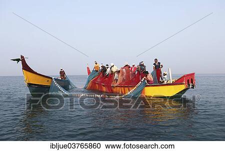 "Local fishermen bringing in the nets onto their boat, Varkala, Kerala, India, Asia" View Large Photo Image Stock Image - "Local fishermen bringing in the nets onto their boat, Varkala, Kerala, India, Asia". Fotosearch