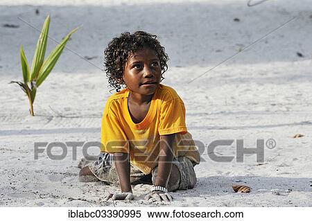 "Local girl playing in the sand, Arborek, Raja Ampat, West Papua, Indonesia, Asia" View Large Photo Image Stock Photography - "Local girl playing in the sand, Arborek, Raja Ampat, West Papua, Indonesia, Asia". Fotosearch