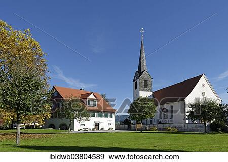 Stock Photo - "Local history museum and the parish church of St. Ambrose, Hergensweiler, Swabia, Bavaria, Germany,, Europe". Fotosearch