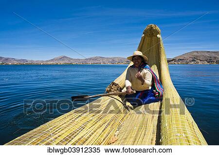 "Local in a traditional rowing boat of Totora reed on Lake Titicaca, Peru, South America" View Large Photo Image Stock Photography - "Local in a traditional rowing boat of Totora reed on Lake Titicaca, Peru, South America". Fotosearch