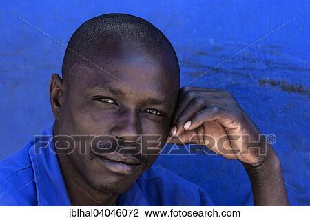"Local man against a blue wall, portrait, Swakopmund, Namibia, Africa" View Large Photo Image Stock Image - "Local man against a blue wall, portrait, Swakopmund, Namibia, Africa". Fotosearch
