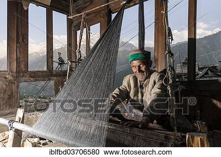 "Local man weaving with a handloom, Sangla Valley, Chitkul, Himachal Pradesh, India, Asia" View Large Photo Image Stock Image - "Local man weaving with a handloom, Sangla Valley, Chitkul, Himachal Pradesh, India, Asia". Fotosearch