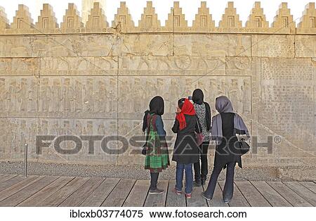 "Local tourists looking at a bas-relief, stone carvings, ancient Persian city of Persepolis, UNESCO World Heritage Site, Fars Province, Iran, Asia" View Large Photo Image Stock Photography - "Local tourists looking at a bas-relief, stone carvings, ancient Persian city of Persepolis, UNESCO World Heritage Site, Fars Province, Iran, Asia". Fotosearch