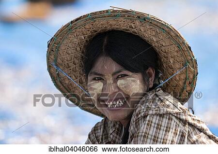 "Local woman with a straw hat and Thanaka paste in her face, portrait, Ngapali, Myanmar, Asia" View Large Photo Image Stock Photograph - "Local woman with a straw hat and Thanaka paste in her face, portrait, Ngapali, Myanmar, Asia". Fotosearch