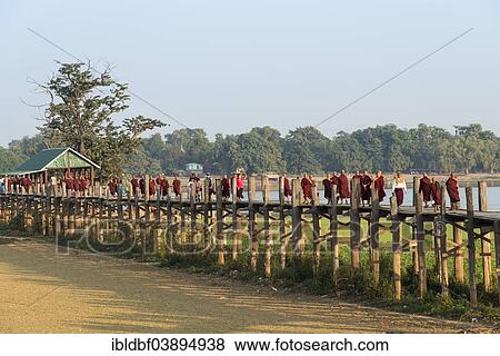 "Locals and monks on a teak bridge, U Bein Bridge, over Thaungthaman Lake, Amarapura, Mandalay Division, Myanmar, Asia" View Large Photo Image Stock Photo - "Locals and monks on a teak bridge, U Bein Bridge, over Thaungthaman Lake, Amarapura, Mandalay Division, Myanmar, Asia". Fotosearch