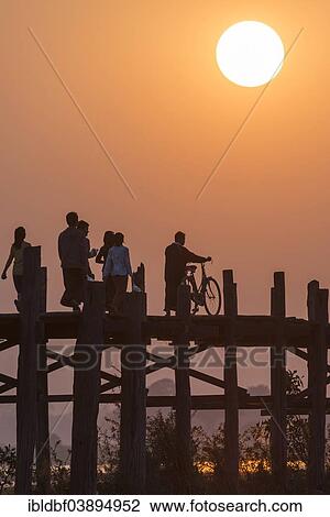 "Locals and tourists walking on a teak bridge, U Bein Bridge across Thaungthaman Lake at sunset, Amarapura, Mandalay Division, Myanmar, Asia" View Large Photo Image Stock Image - "Locals and tourists walking on a teak bridge, U Bein Bridge across Thaungthaman Lake at sunset, Amarapura, Mandalay Division, Myanmar, Asia". Fotosearch