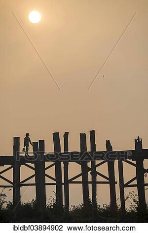"Locals on a teak bridge, U Bein Bridge over Taungthaman Lake at sunrise, Amarapura, Mandalay Division, Myanmar, Asia" View Large Photo Image Stock Image - "Locals on a teak bridge, U Bein Bridge over Taungthaman Lake at sunrise, Amarapura, Mandalay Division, Myanmar, Asia". Fotosearch